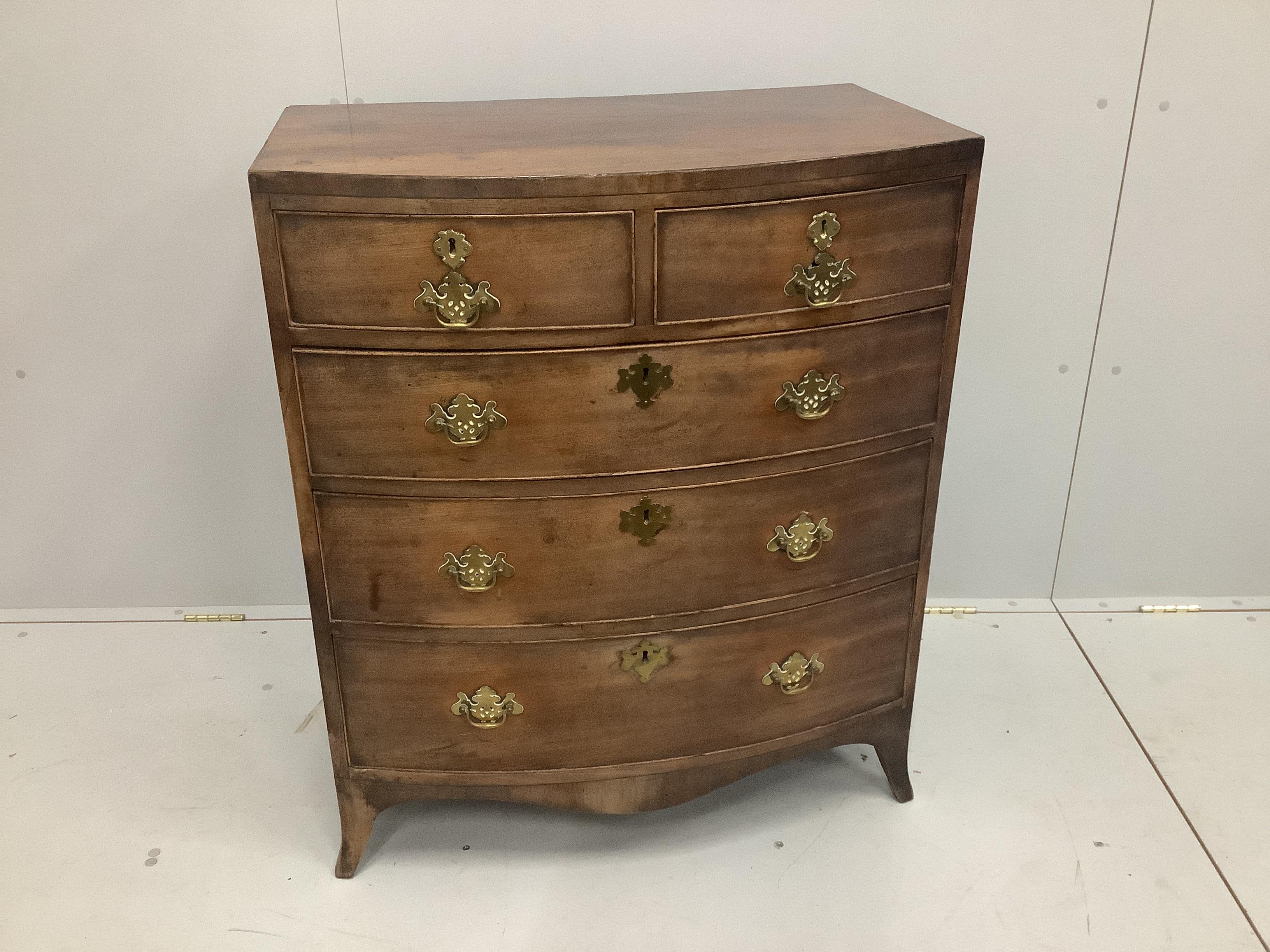 A Regency mahogany bowfront chest of two short and three long drawers, of slender proportions, width 79cm